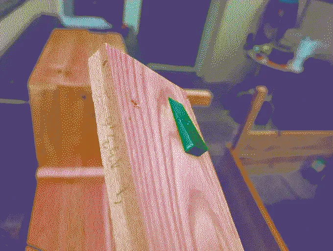 The 3D printed spacer placed on a wood plank to ensure the angle is correct